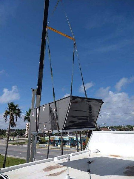 A Crane lifting a Commercial HVAC system being installed by Cubb Cooling and Heating